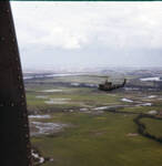 A UH-1 "Huey" helicopter in flight in Vietnam