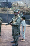 Members of the 1st SIgnal Brigade, Qui Nhơn, Vietnam, 1969-1970 (two soldiers, and woman)