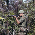 Christopher Ammons firing an M16, Vietnam, 1967-1968